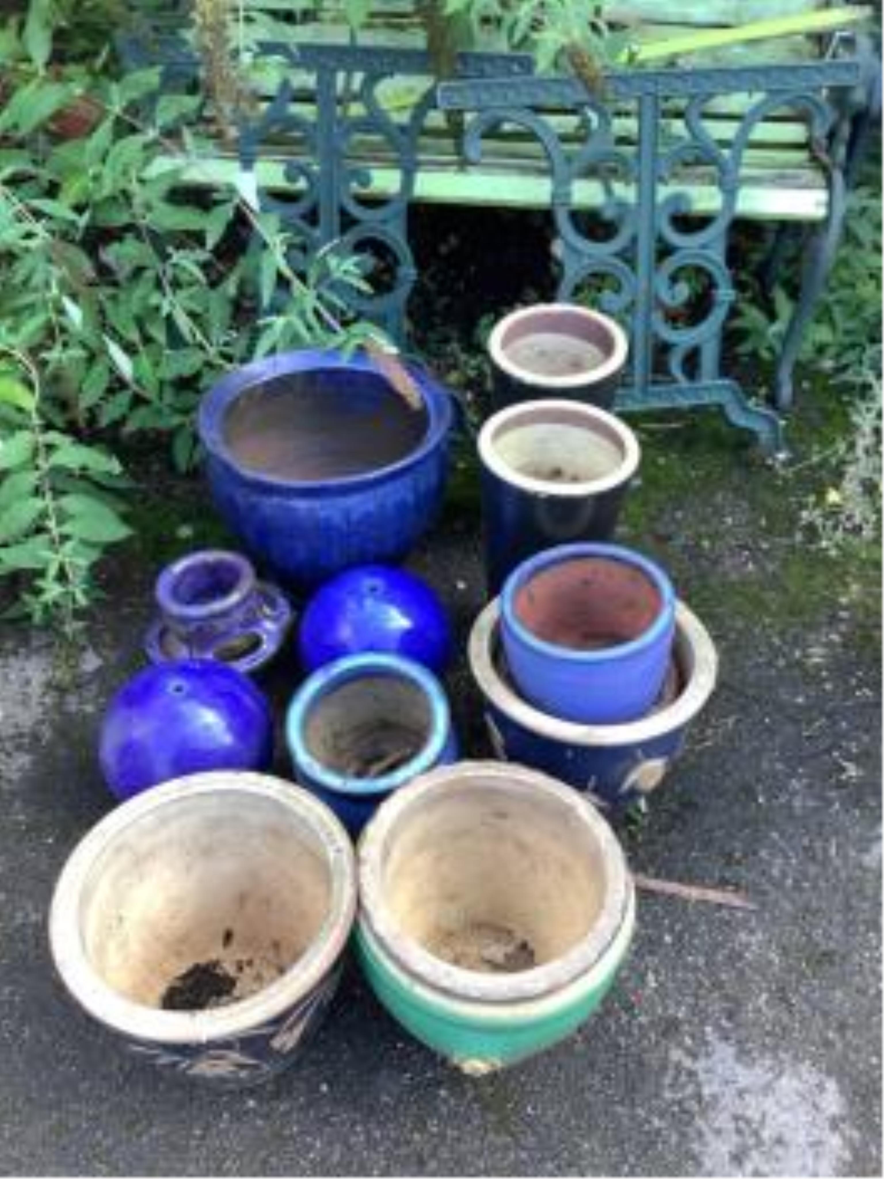 A collection of assorted glazed pottery garden pots and ornaments, largest diameter 42cm. Condition - all used and weathered but essentially fair